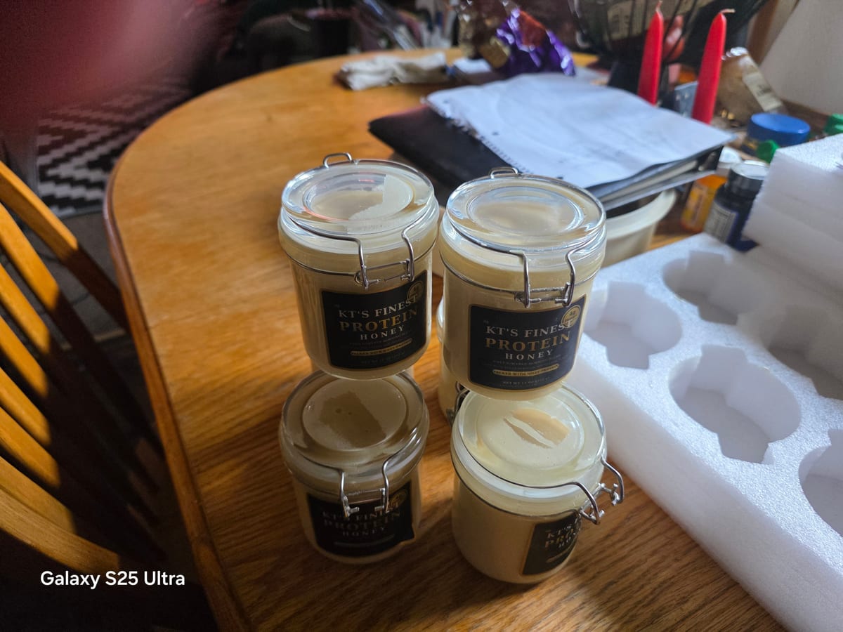 Labeled jars of KT's Finest stacked on the kitchen table
